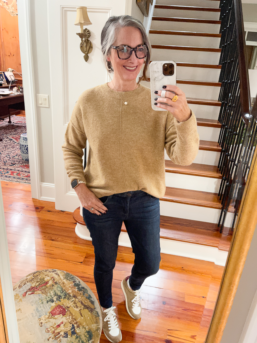 mirror selfie in jeans, sneakers and tan sweater