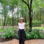 woman in black pants on patio