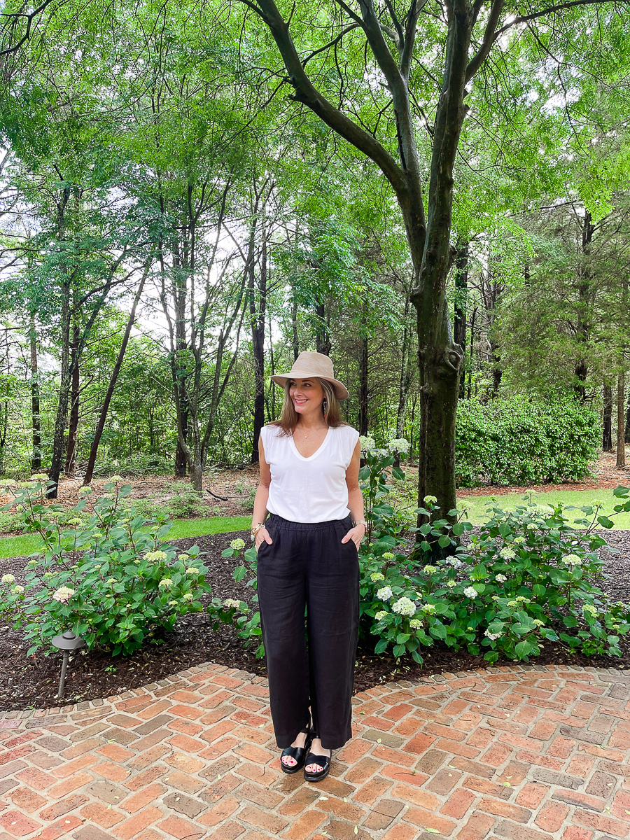 woman in black pants on patio