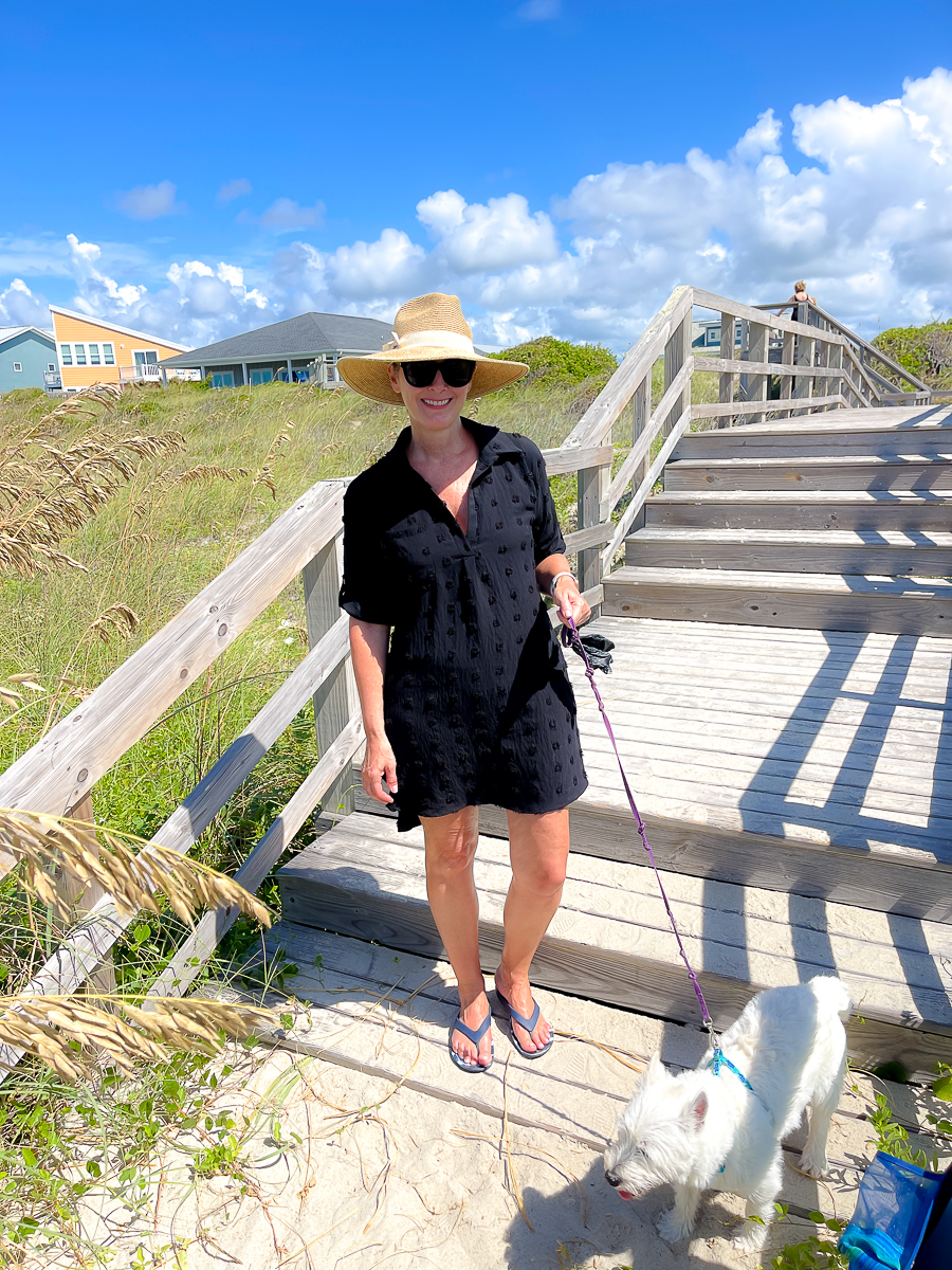 woman on beach with dog