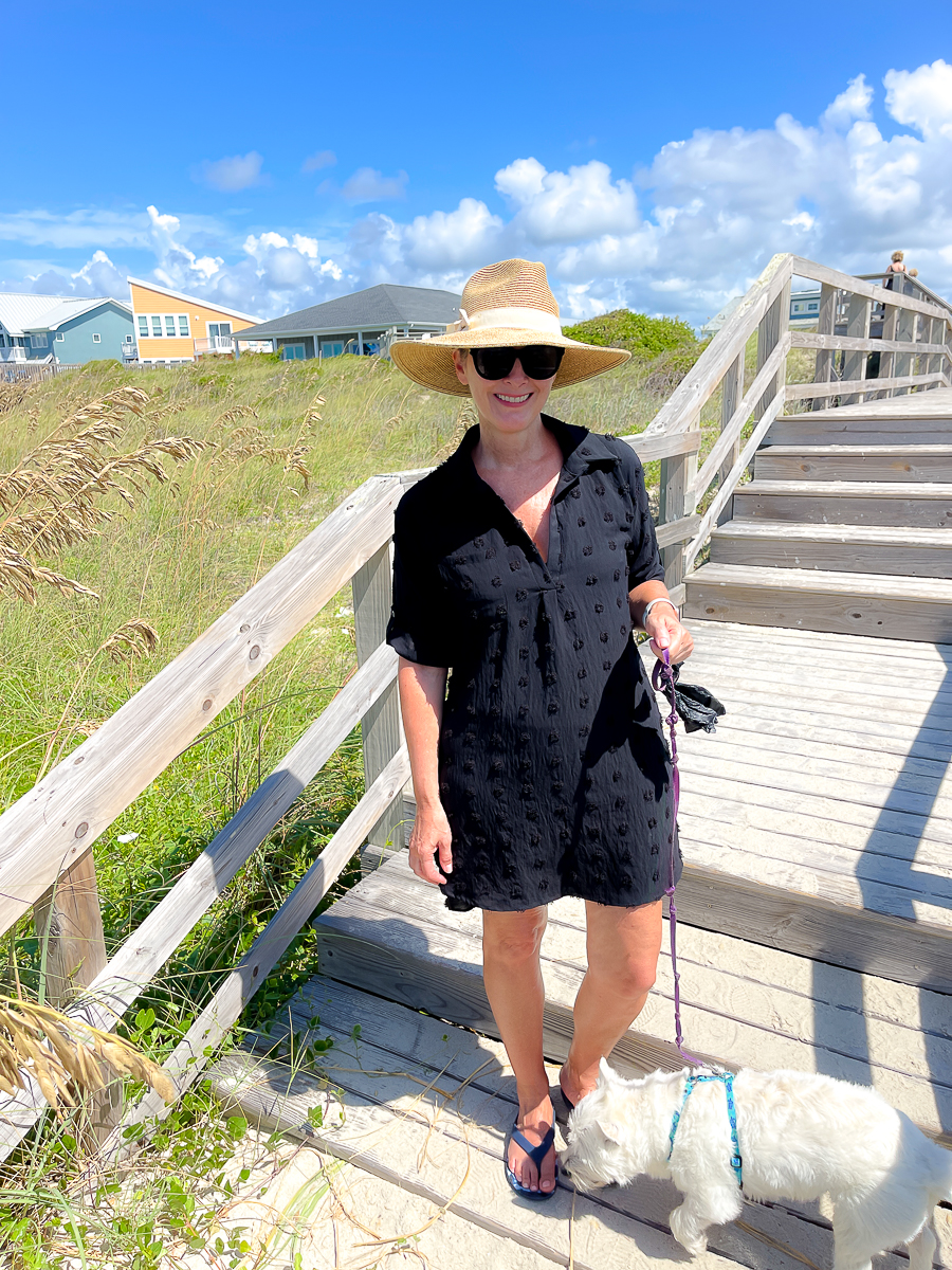 woman on beach with dog