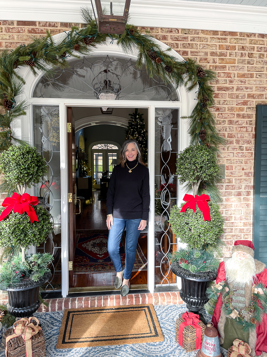 christy in front door decorated for christmas