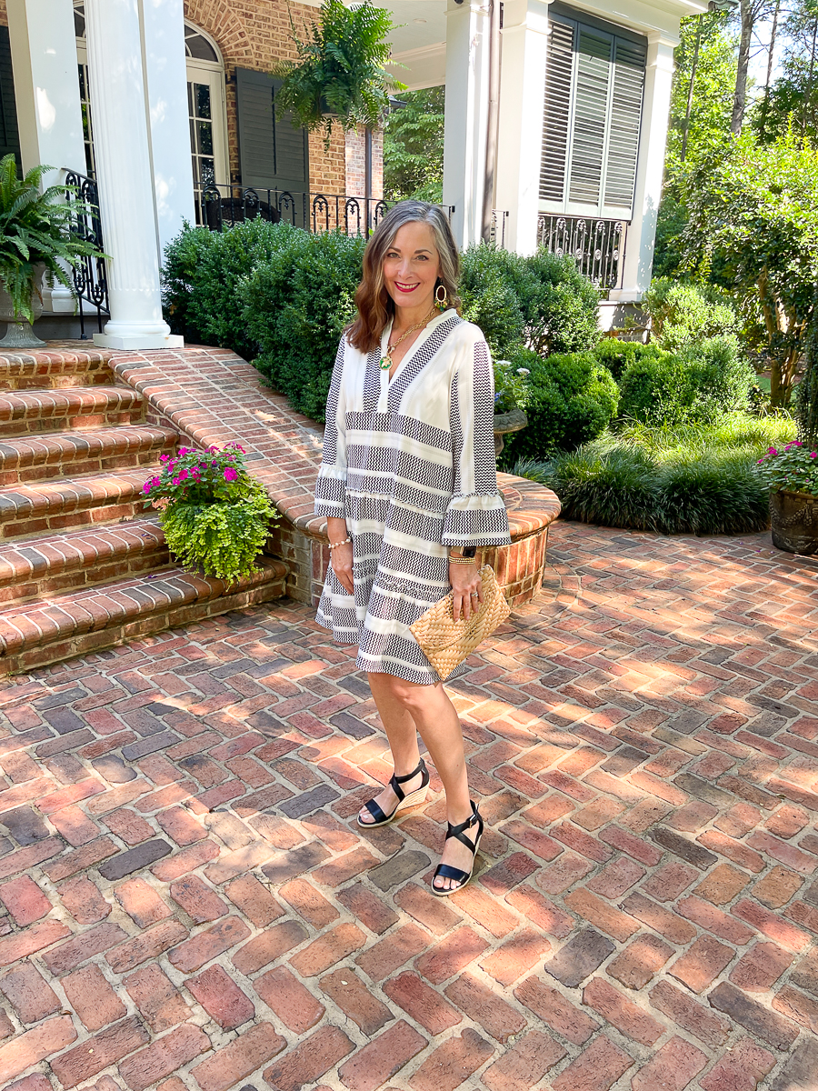 woman in black and white dress on patio