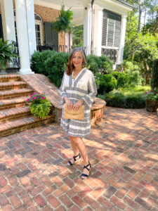 woman in black and white dress on patio