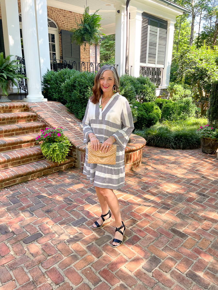 woman in black and white dresws on patio