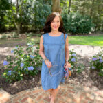 lady in blue dress on walkway