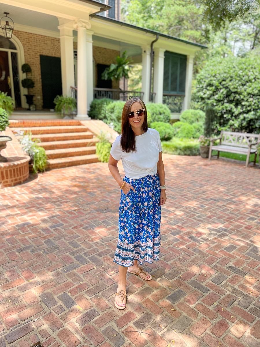 woman standing in front of a house