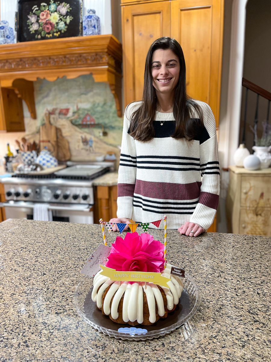 girl in front of cake