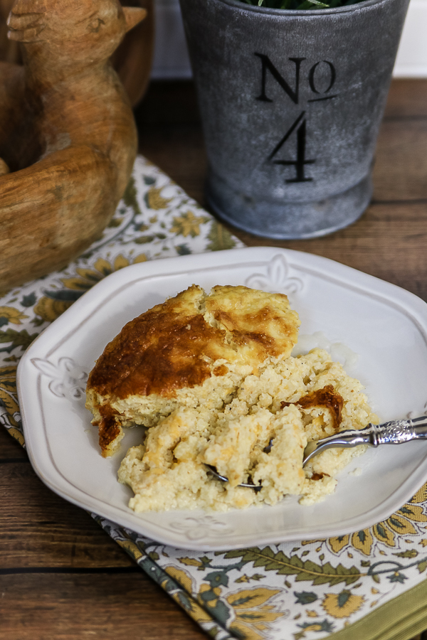 Make ahead cheese grits are perfect for a holiday morning! #cheesegrits #recipe #grits #makeaheadbreakfast #breakfast #christmasmorningbreakfast #holidaybreakfast