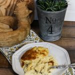 Make ahead cheese grits are perfect for a holiday morning! #cheesegrits #recipe #grits #makeaheadbreakfast #breakfast #christmasmorningbreakfast #holidaybreakfast