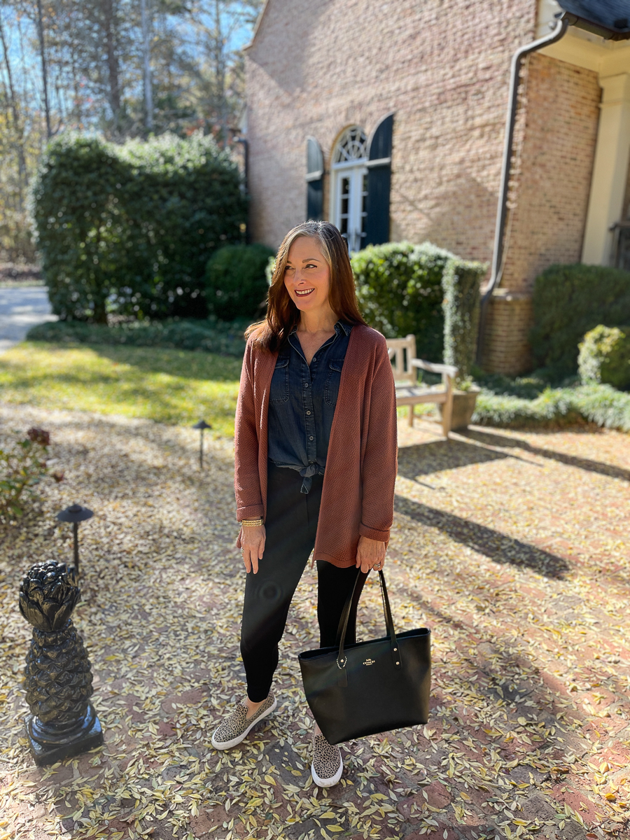 woman in fall outfit on patio