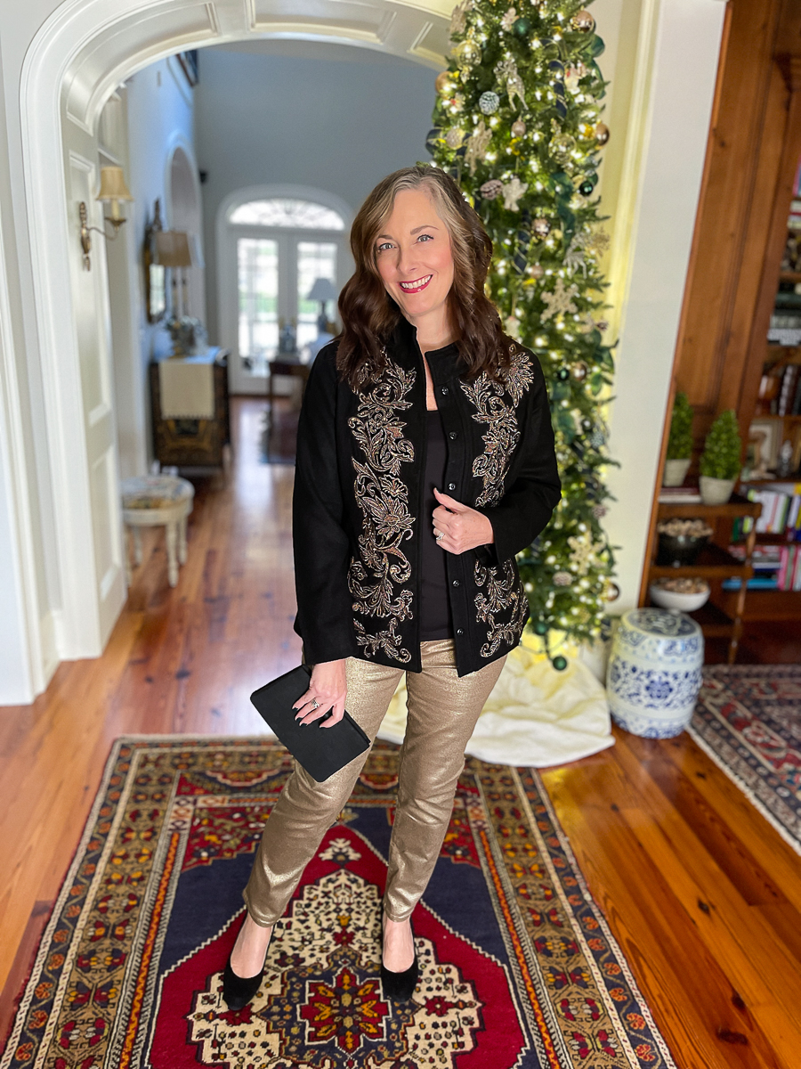 woman in holiday outfit in foyer