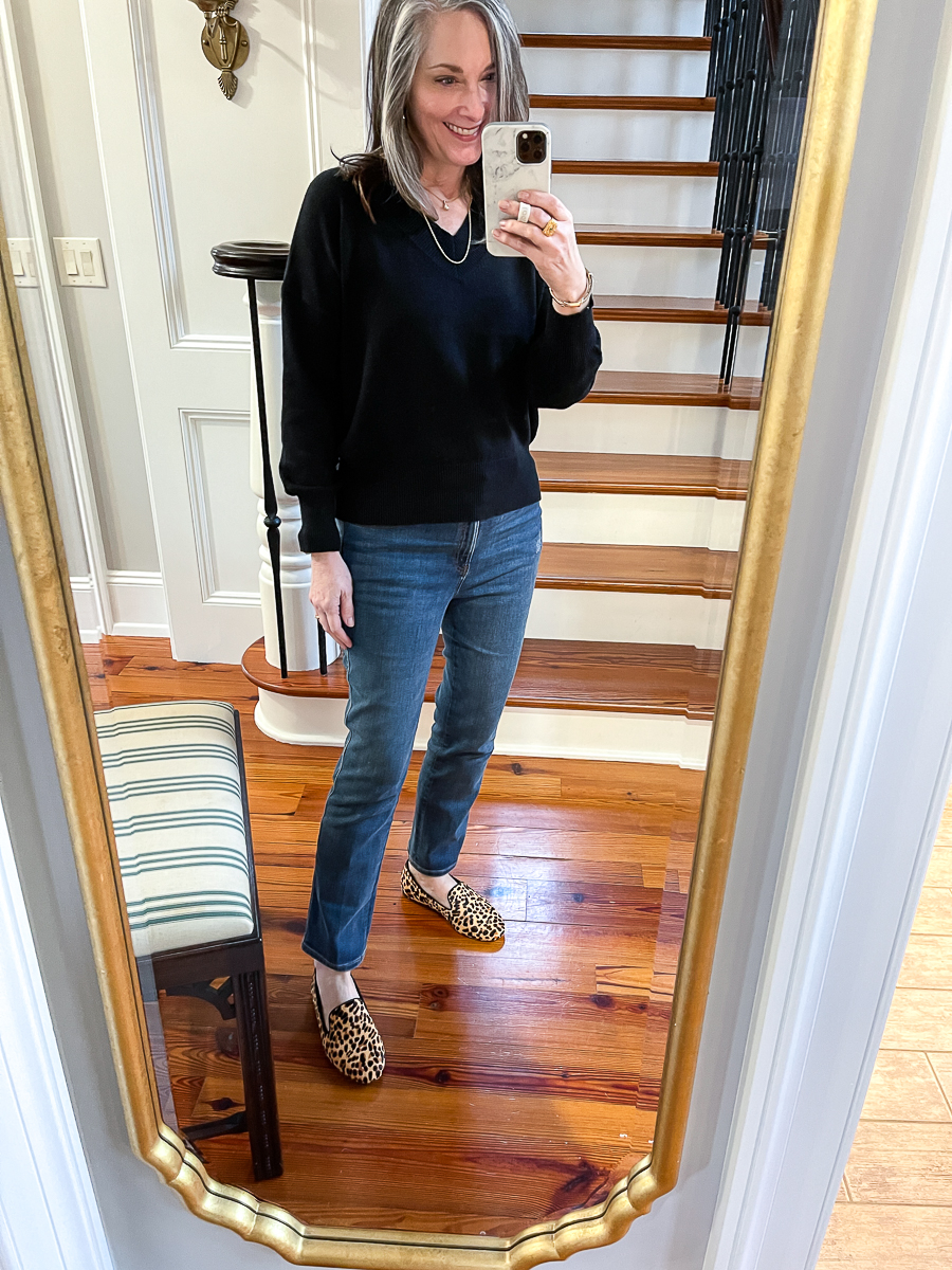 christy in jeans, black sweater and leopard flats