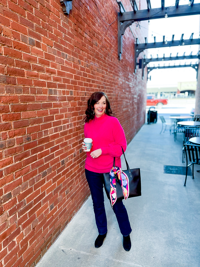 woman by brick wall