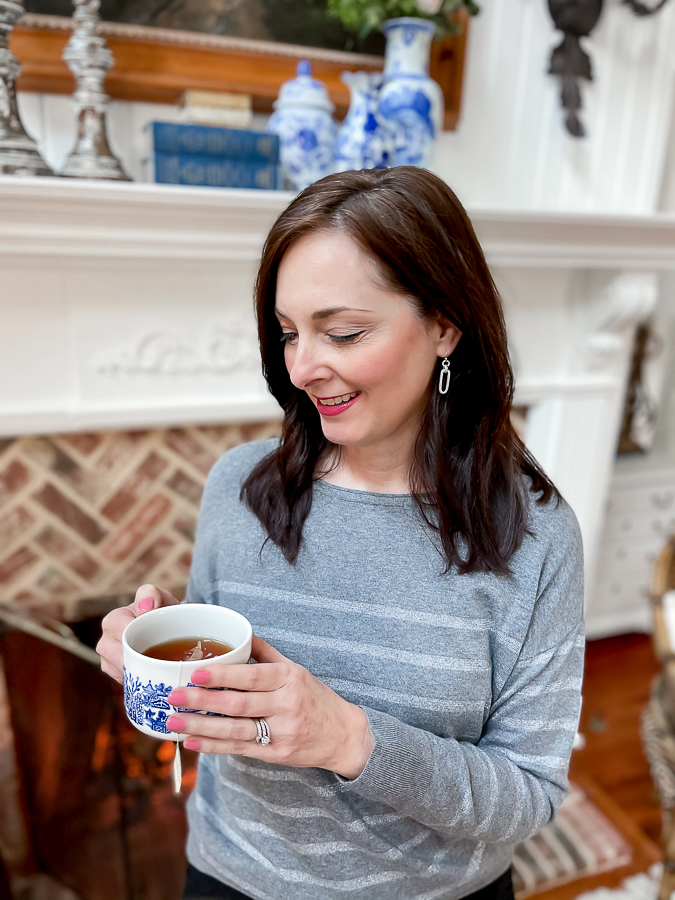 woman holding a cup of tea