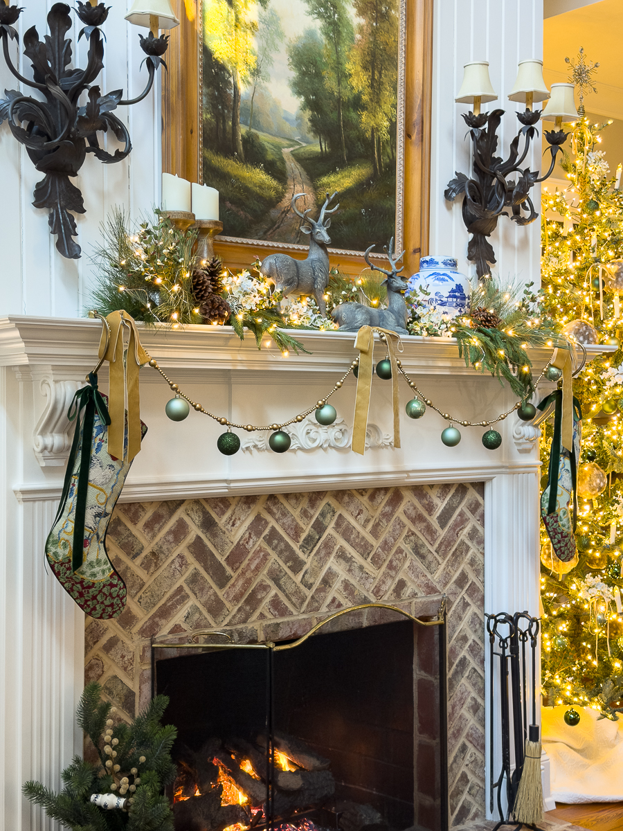 christmas mantel with stocking, deer, greenery and chinoiserie ginger jar