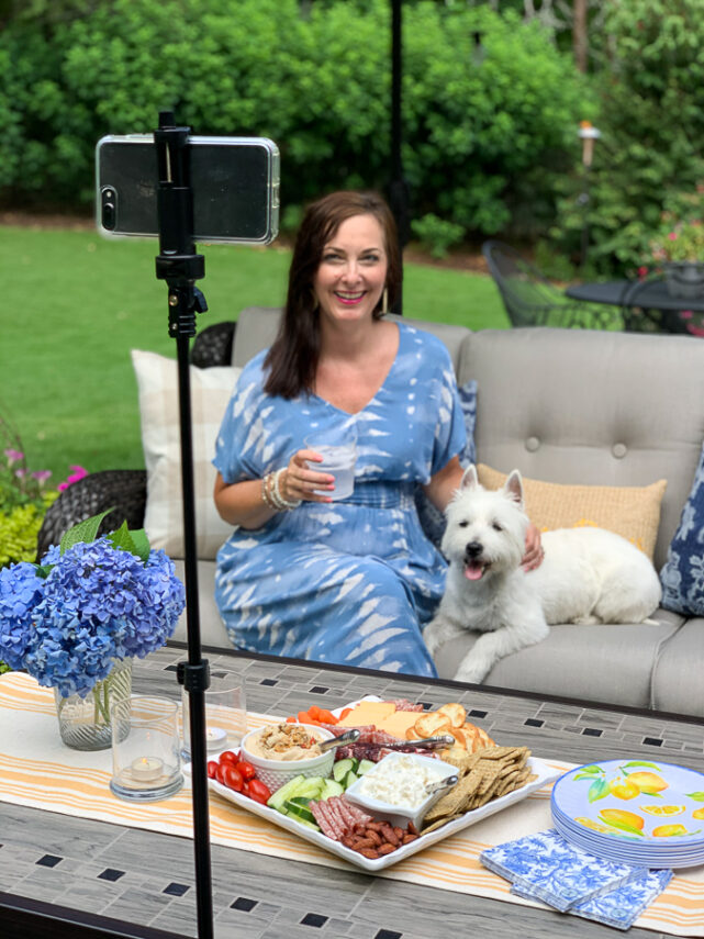 girl and dog sitting on patio