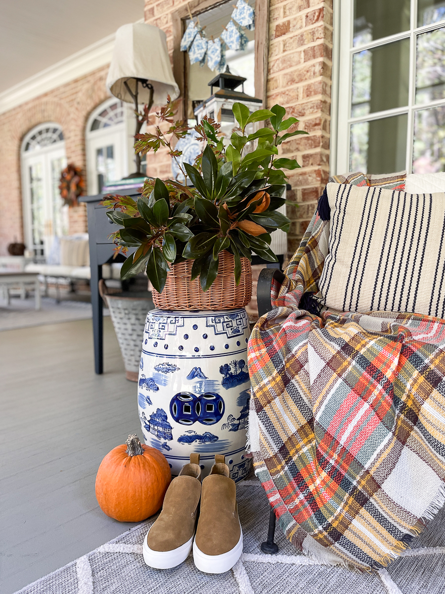 fall vignette with pumpkins and hoes