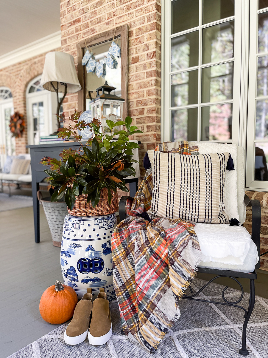 fall vignette on a screened porch