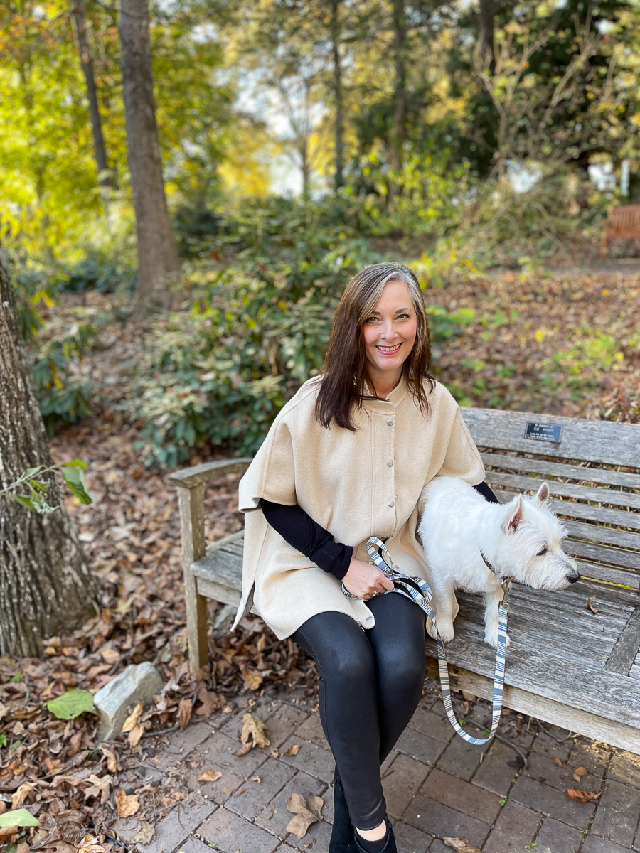 woman with dog on bench