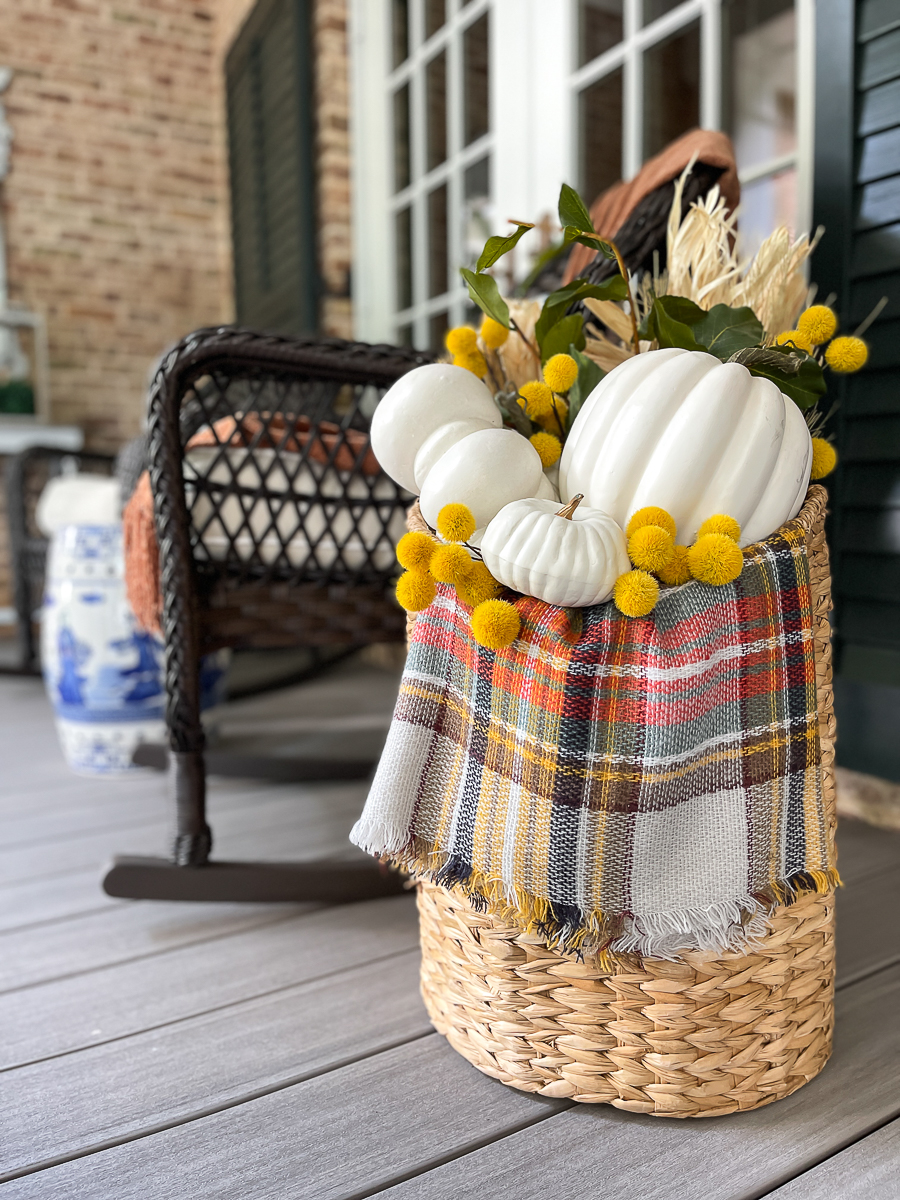 floral basket with pumpkins