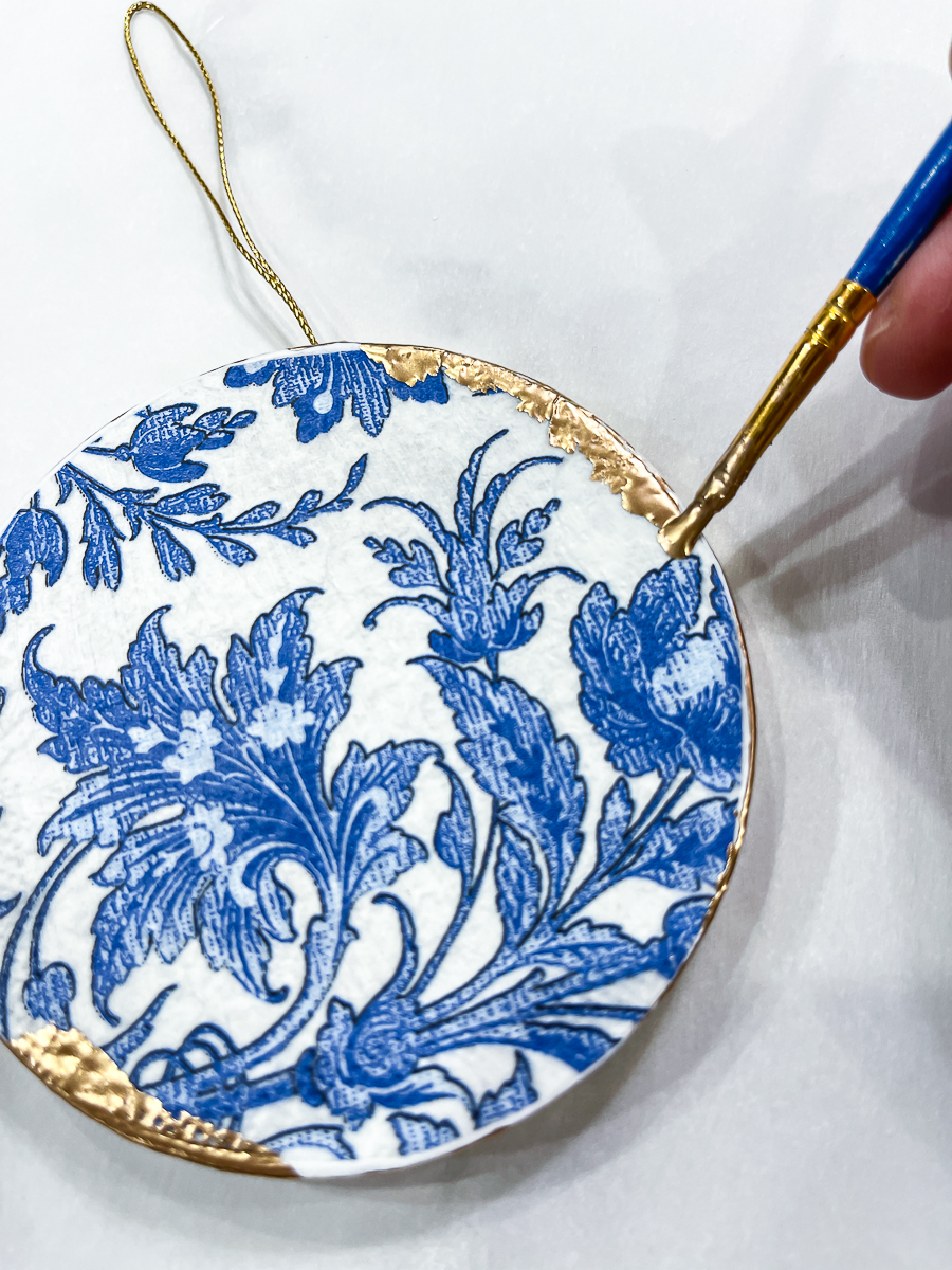painting gold leaf on ornament
