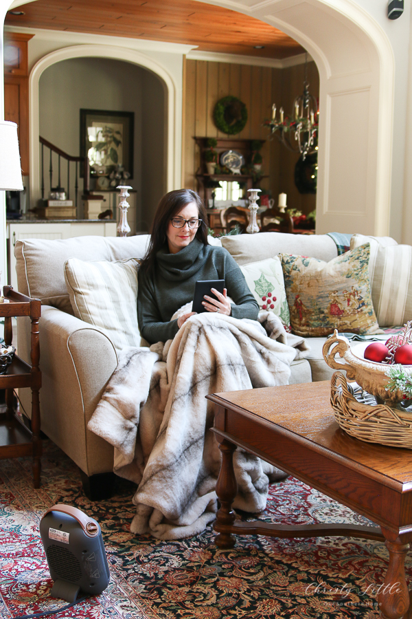 space heater with woman reading