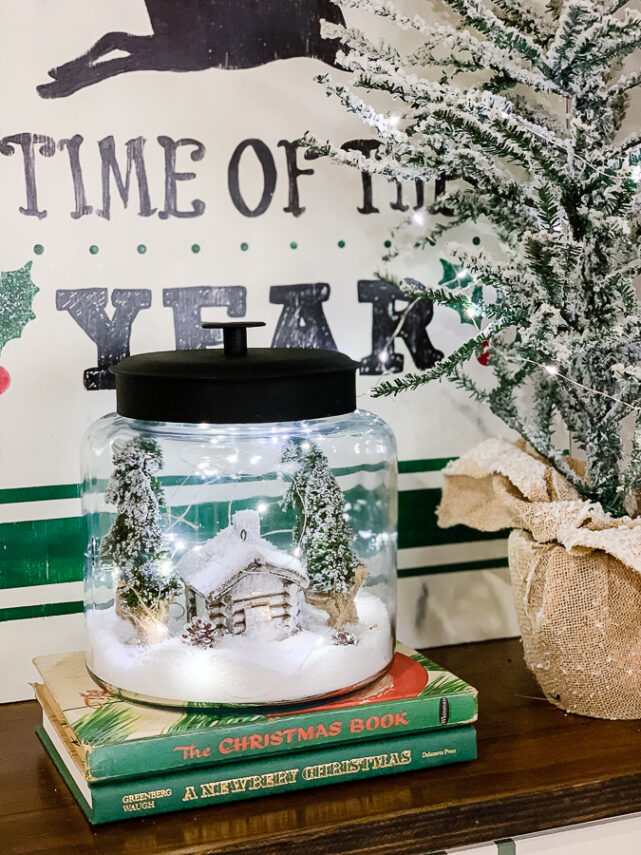 christmas scene in a cookie jar with fairy lights
