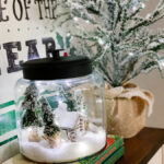 snowy cabin scene in a jar