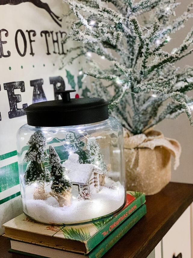 snowy cabin scene in a jar