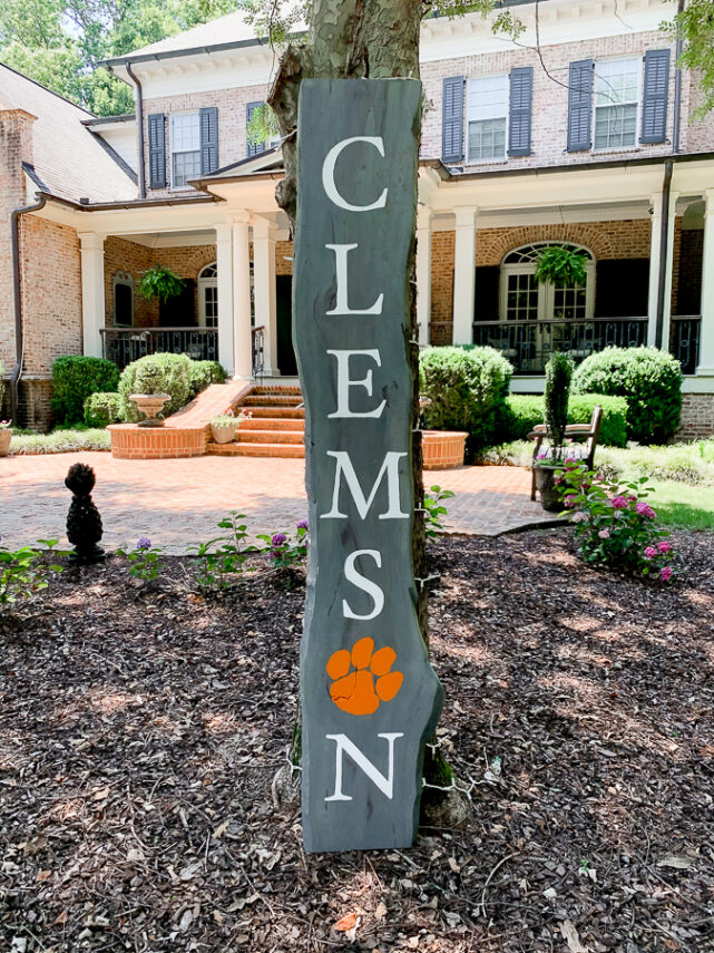 Clemson sign leaning on a tree