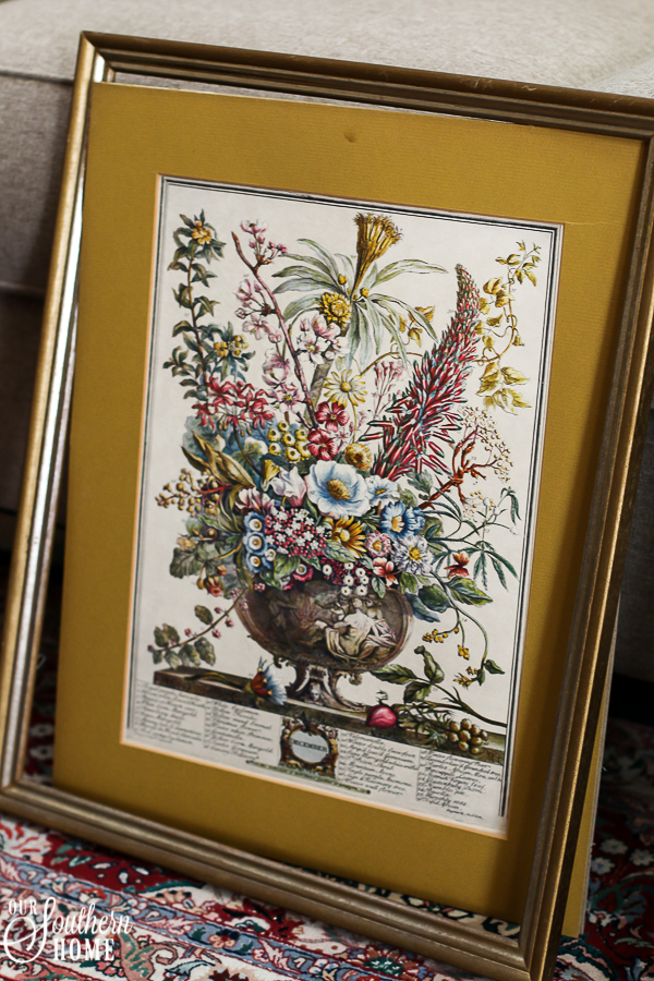 Thrift store framed art is easily turned into an earring organizer!