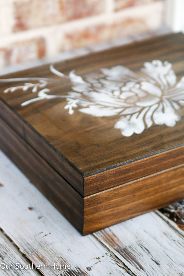 DIY stenciled essential oils storage box is a simple spruce up to unfinished storage.