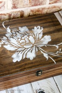 DIY stenciled essential oils storage box is a simple spruce up to unfinished storage.