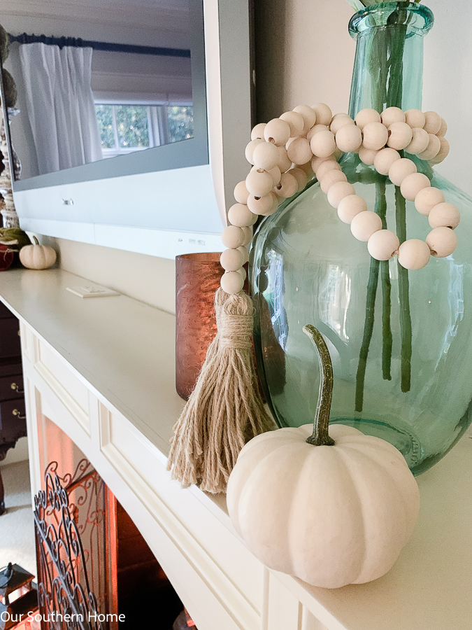 green vase with beads