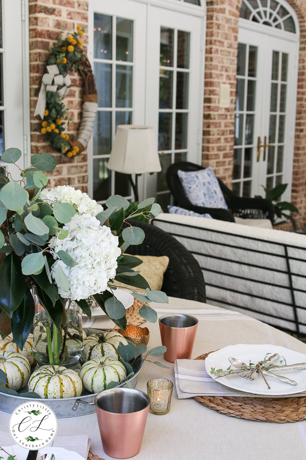 porch table decorated for fall