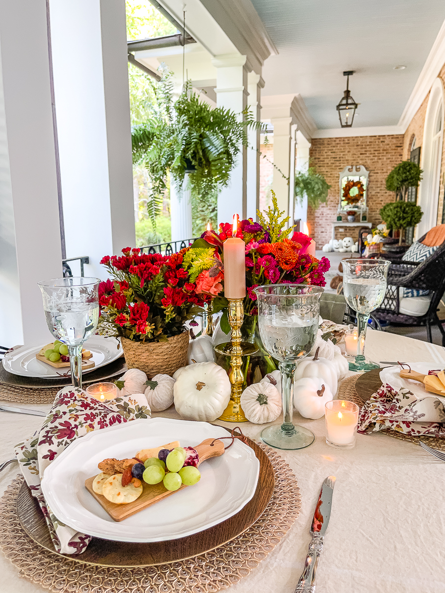 brass candlesticks and pumpkins