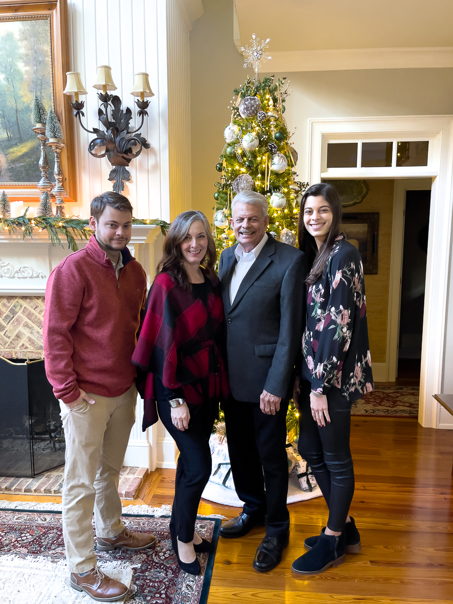 family in front of a tree