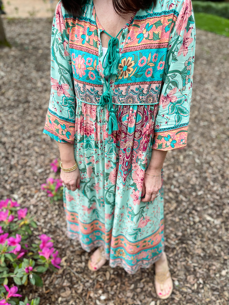 woman in yard wearing a dress