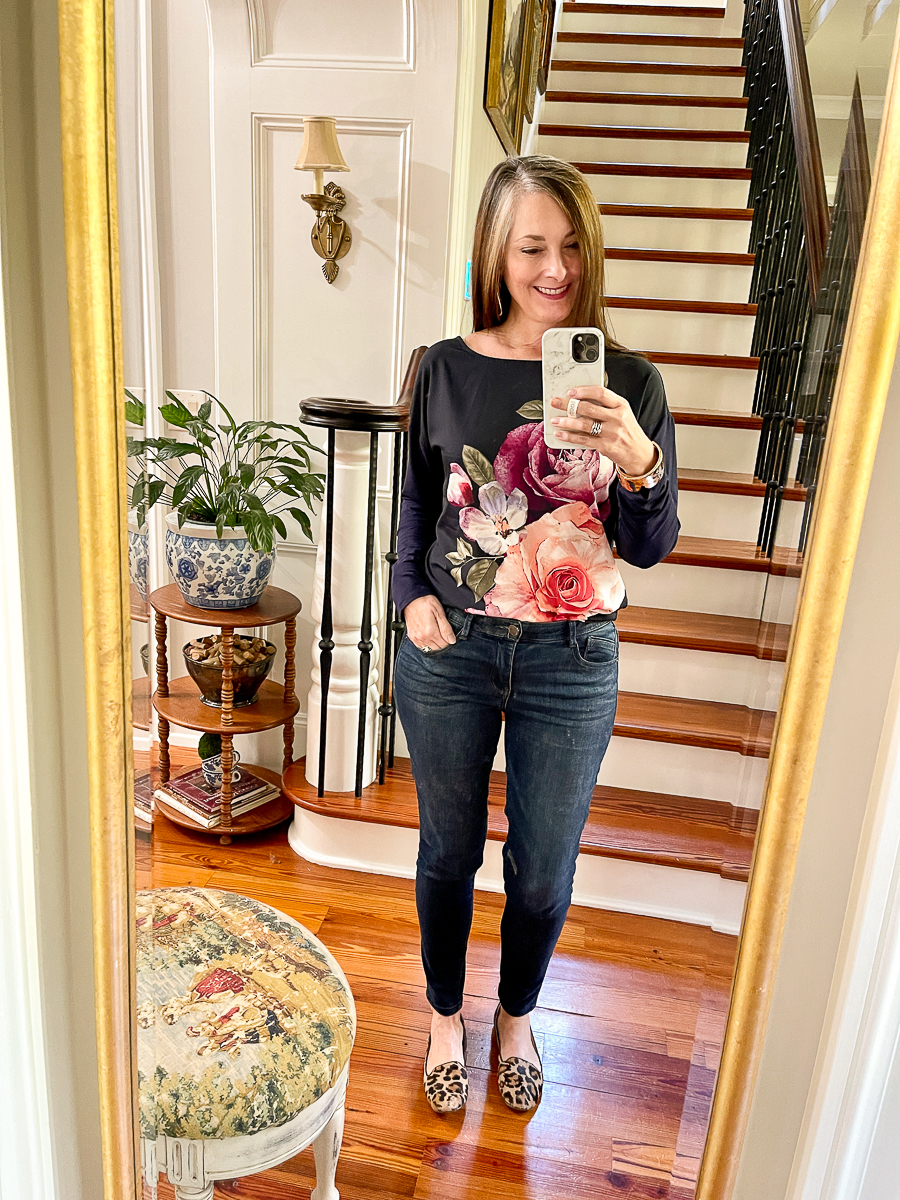 mirror selfie in floral tee and jeans