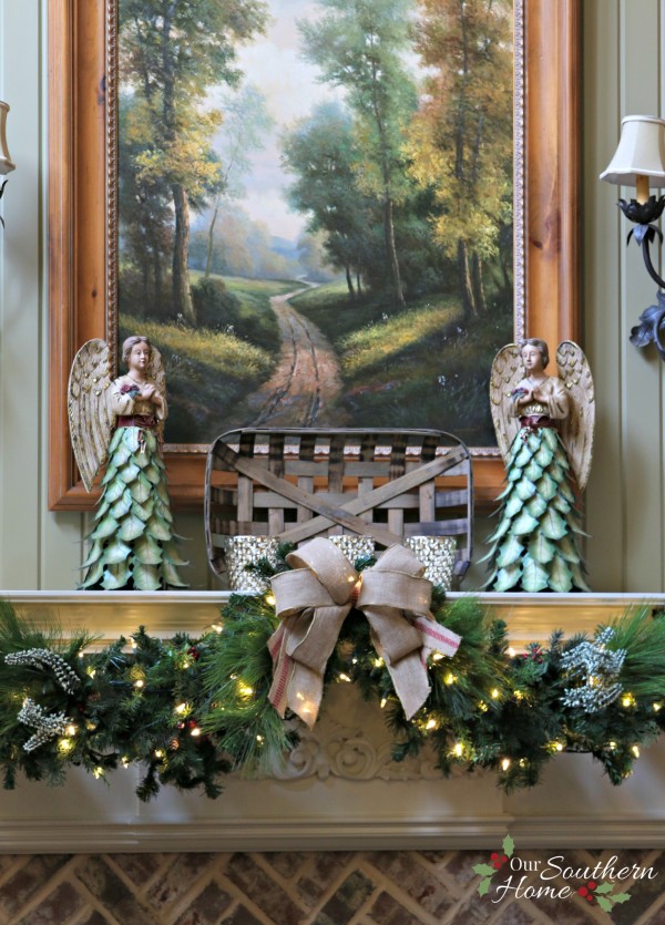 French Country Christmas mantel featuring large PEACE letters and gorgeous metal angels by Our Southern Home