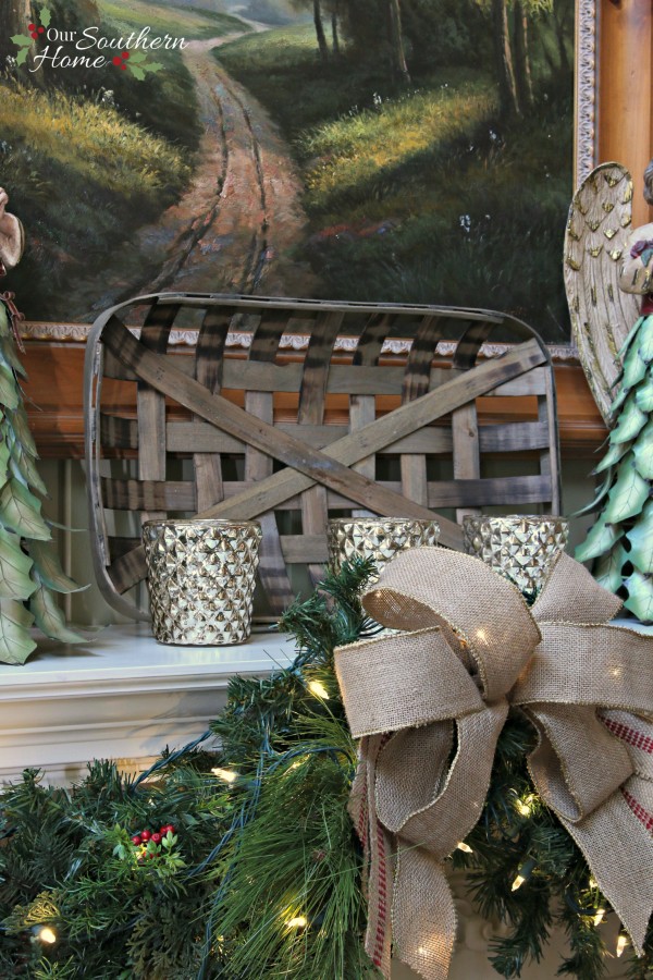 French Country Christmas mantel featuring large PEACE letters and gorgeous metal angels by Our Southern Home