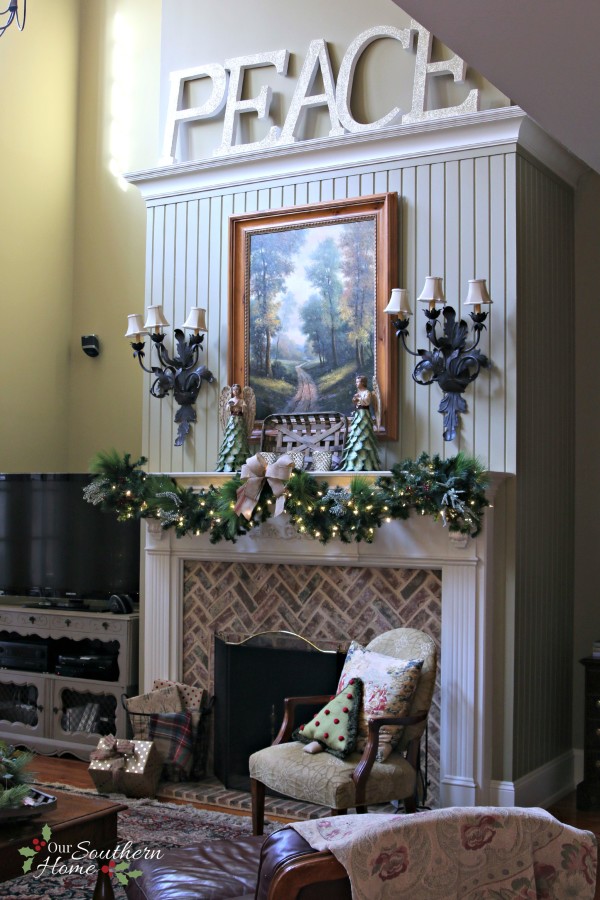 French Country Christmas mantel featuring large PEACE letters and gorgeous metal angels by Our Southern Home