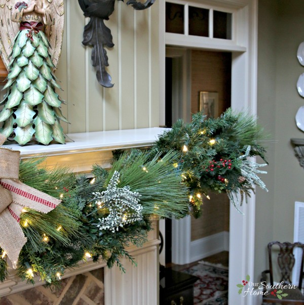 French Country Christmas mantel featuring large PEACE letters and gorgeous metal angels by Our Southern Home