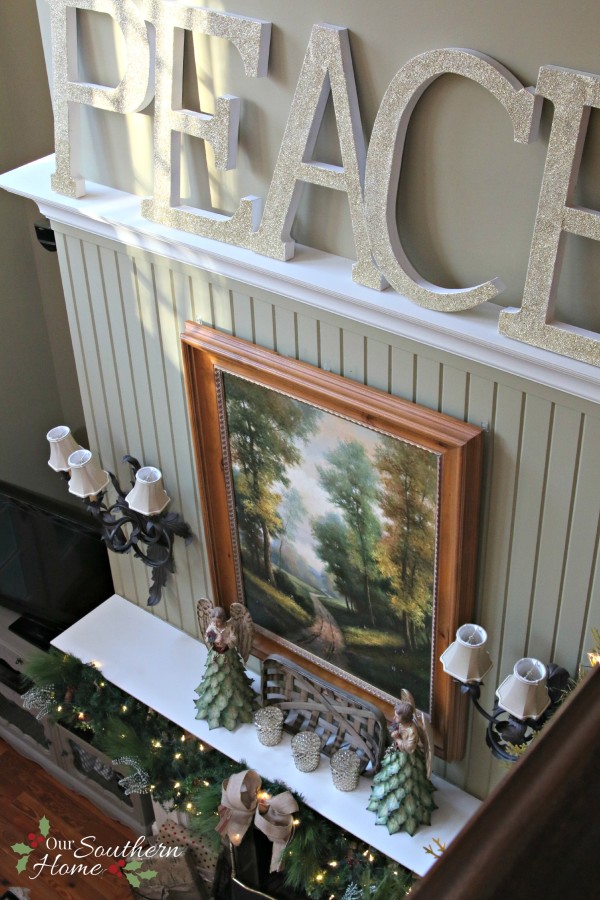 French Country Christmas mantel featuring large PEACE letters and gorgeous metal angels by Our Southern Home