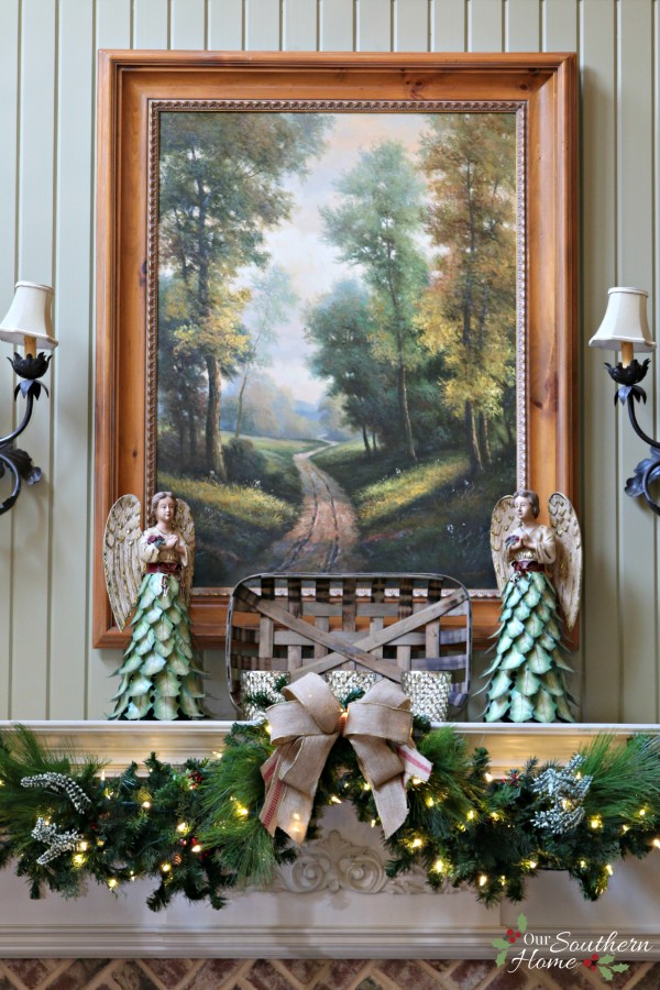 French Country Christmas mantel featuring large PEACE letters and gorgeous metal angels by Our Southern Home