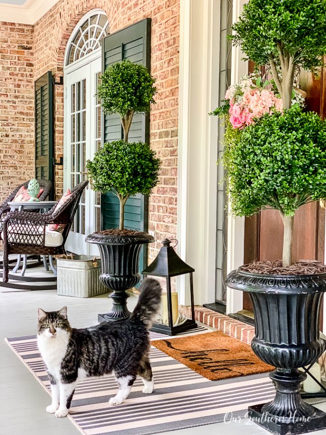 front porch with topiaries