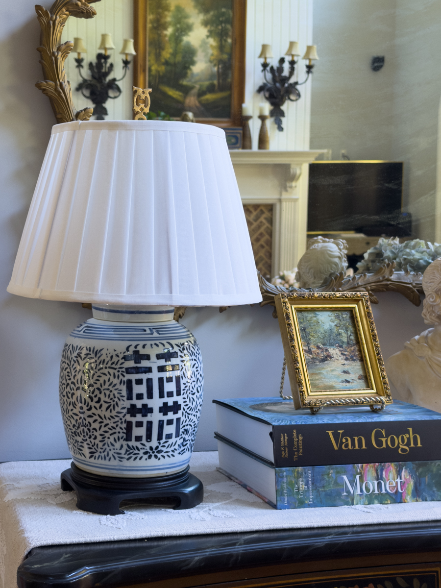 Thrifted blue and white ginger jar lamp with new white pleated shade