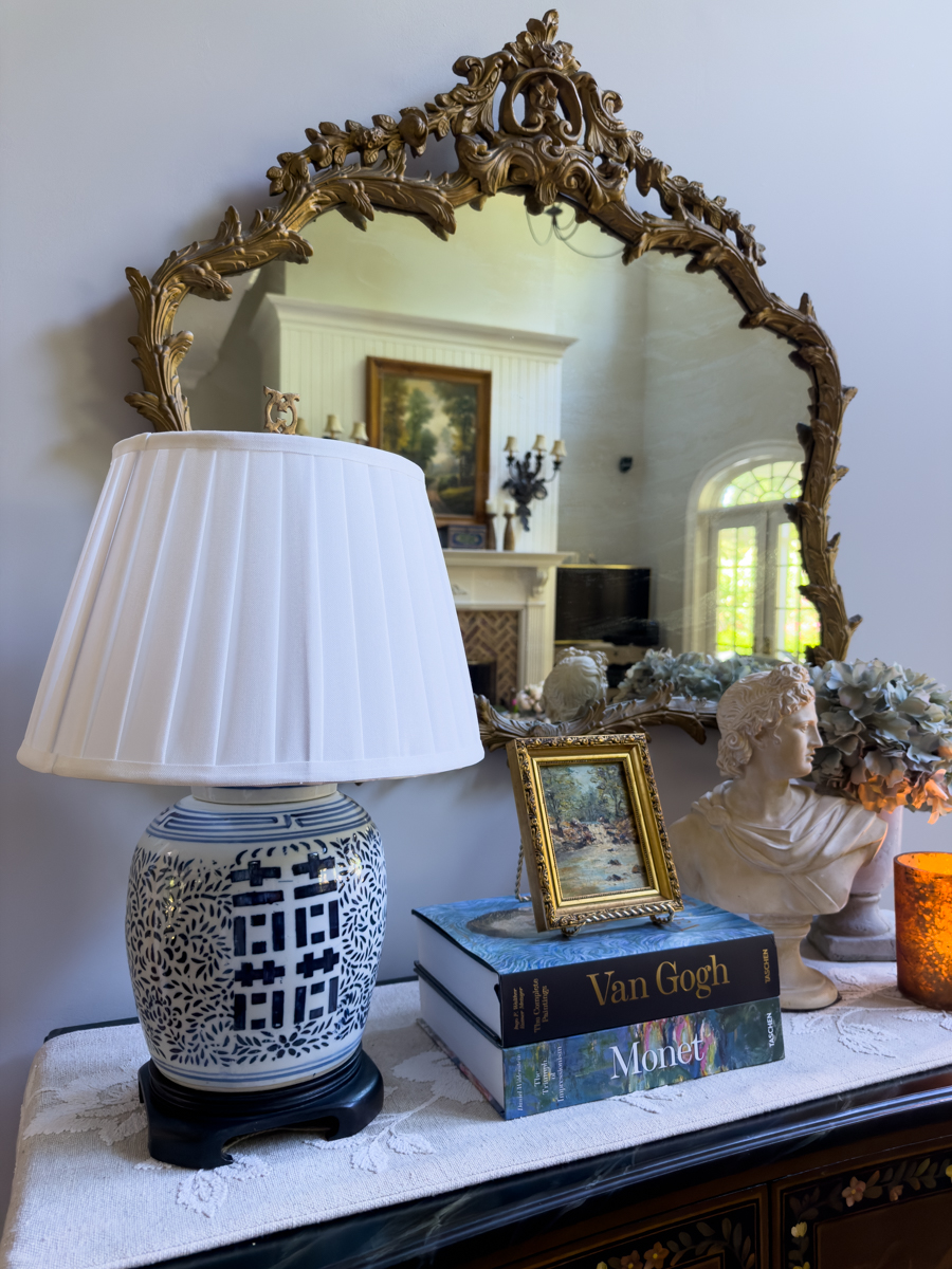 Finished blue and white ginger jar lamp makeover with white pleated shade