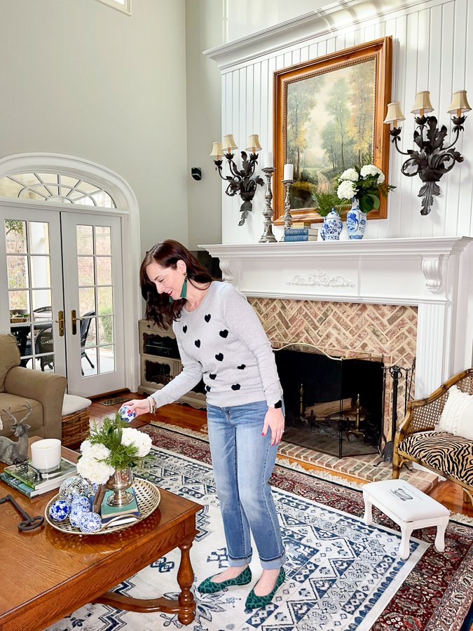 lady decorating a vignette